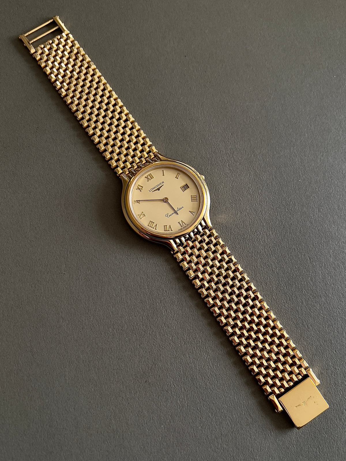 Longines Cosmopolitan Gold Roman Dial Unisex Watch — angled view of dial and bracelet.
