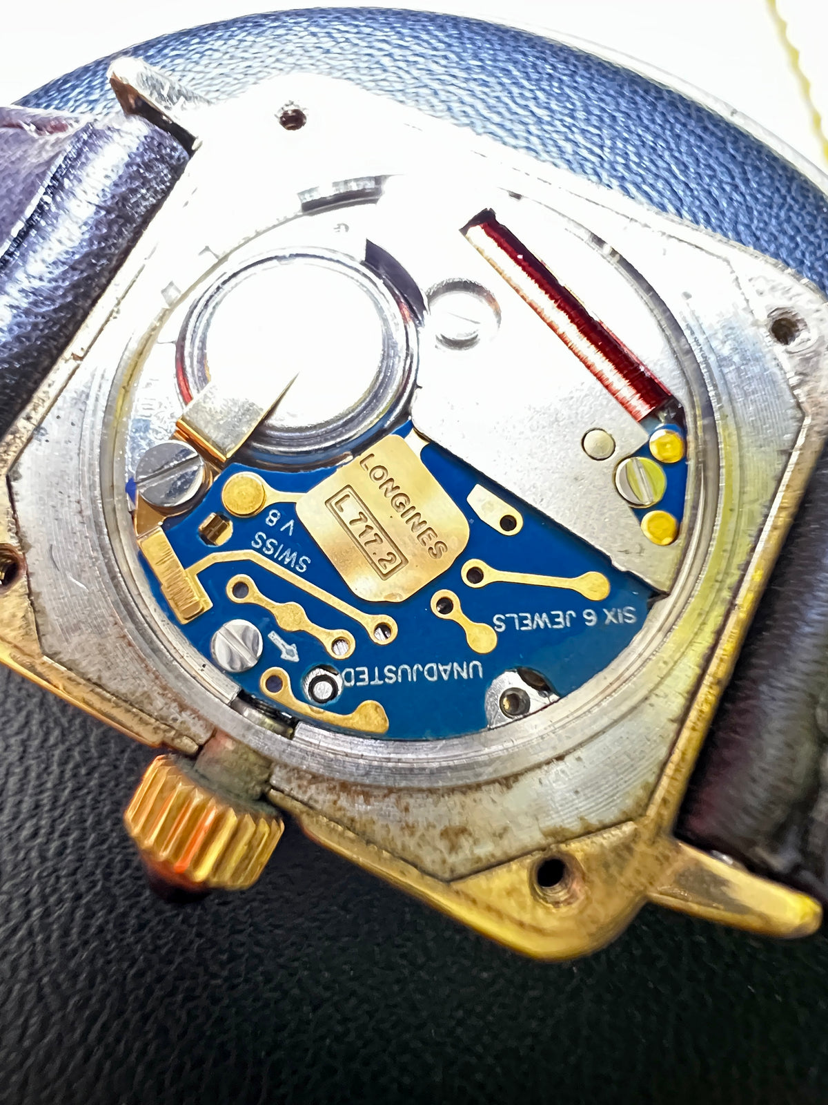 Close-up of the replacement black leather strap attached to the Longines Decorated Corner watch.