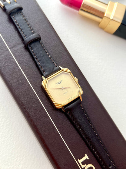 Detail of the black leather aftermarket strap and buckle on the Longines ladies watch.