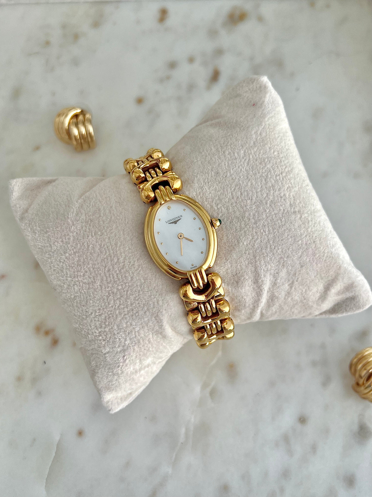 Longines Equestrian L6.132.2 gold-tone bracelet watch with pale dial, shown with coordinating jewellery