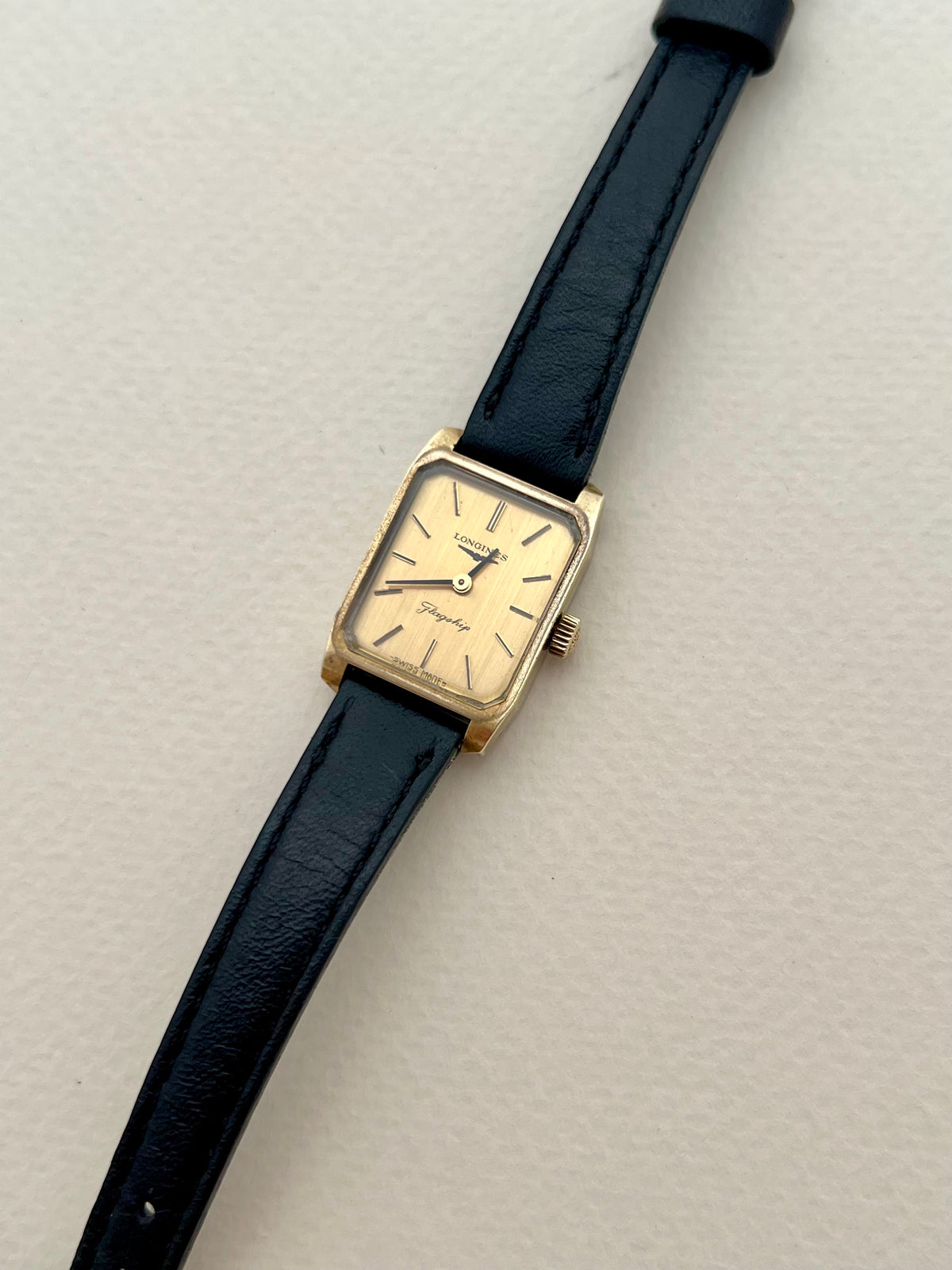 Longines Flagship Gold Rectangular Champagne Dial watch — angled dial