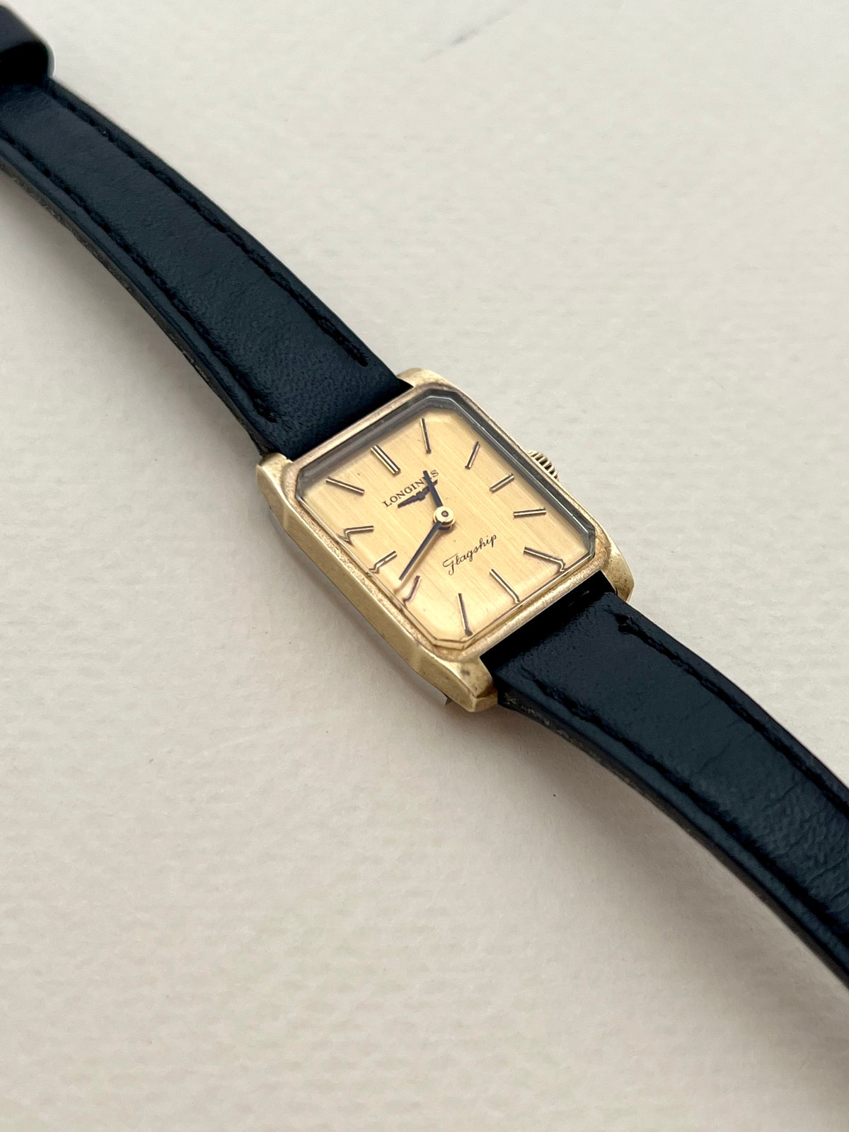 Longines Flagship Gold Rectangular Champagne Dial watch — angled front