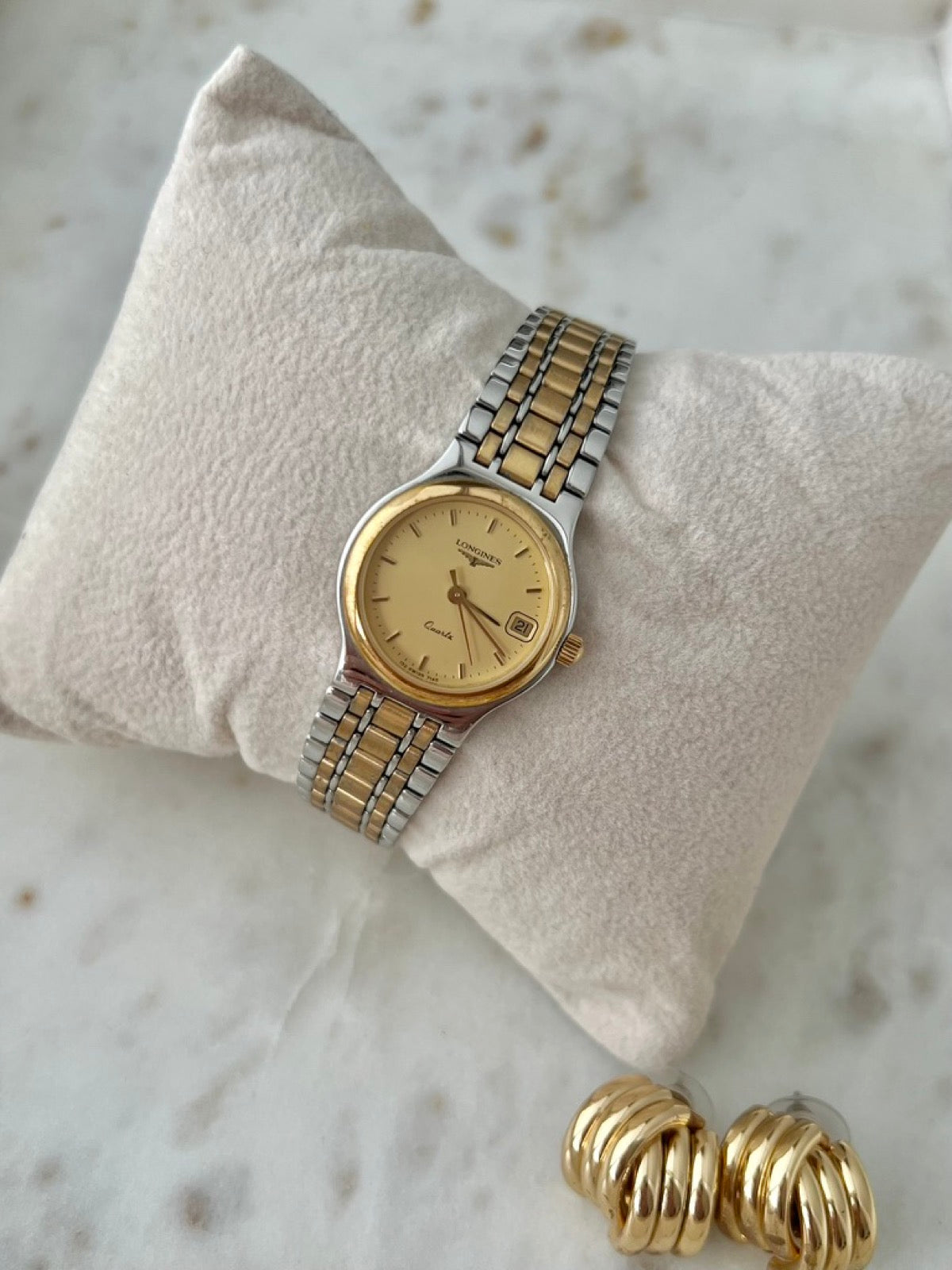 Longines Flagship two tone bracelet watch with champagne dial, date window and gold tone bezel, front view
