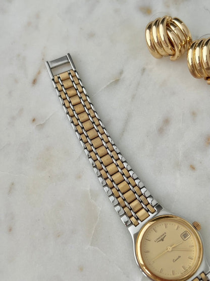 Second angled view of the Longines Flagship champagne dial and bracelet