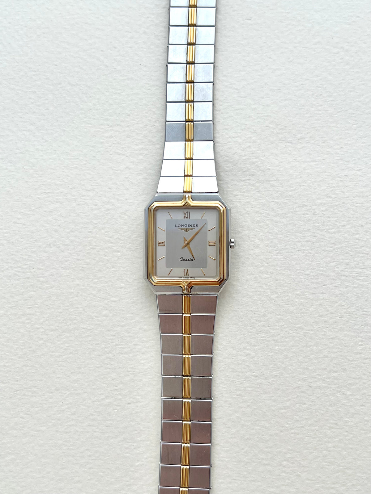 Longines Flagship two-tone rectangular watch, angle.