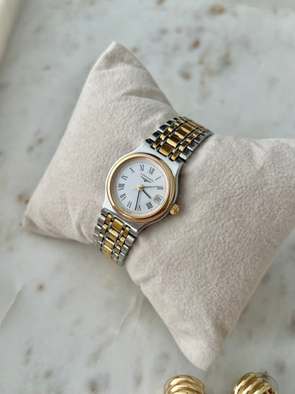 Longines Flagship two tone women’s watch with ivory Roman numeral dial, gold tone bezel and date window
