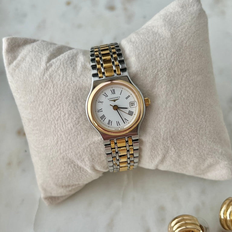 Longines Flagship two tone women’s watch straight on with ivory Roman numeral dial and date display