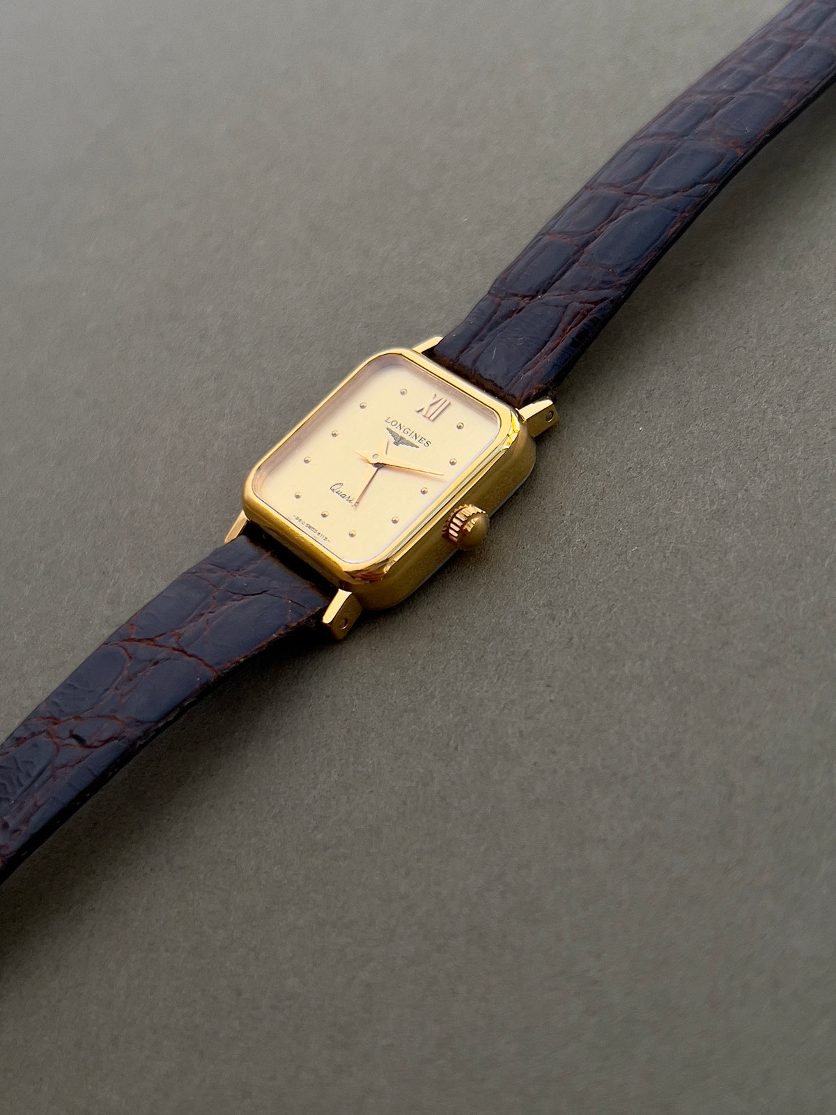 Longines Gold Toned Soft Rectangular Women's Watch, wrist shot of a vintage women's watch at Gilded Hour.