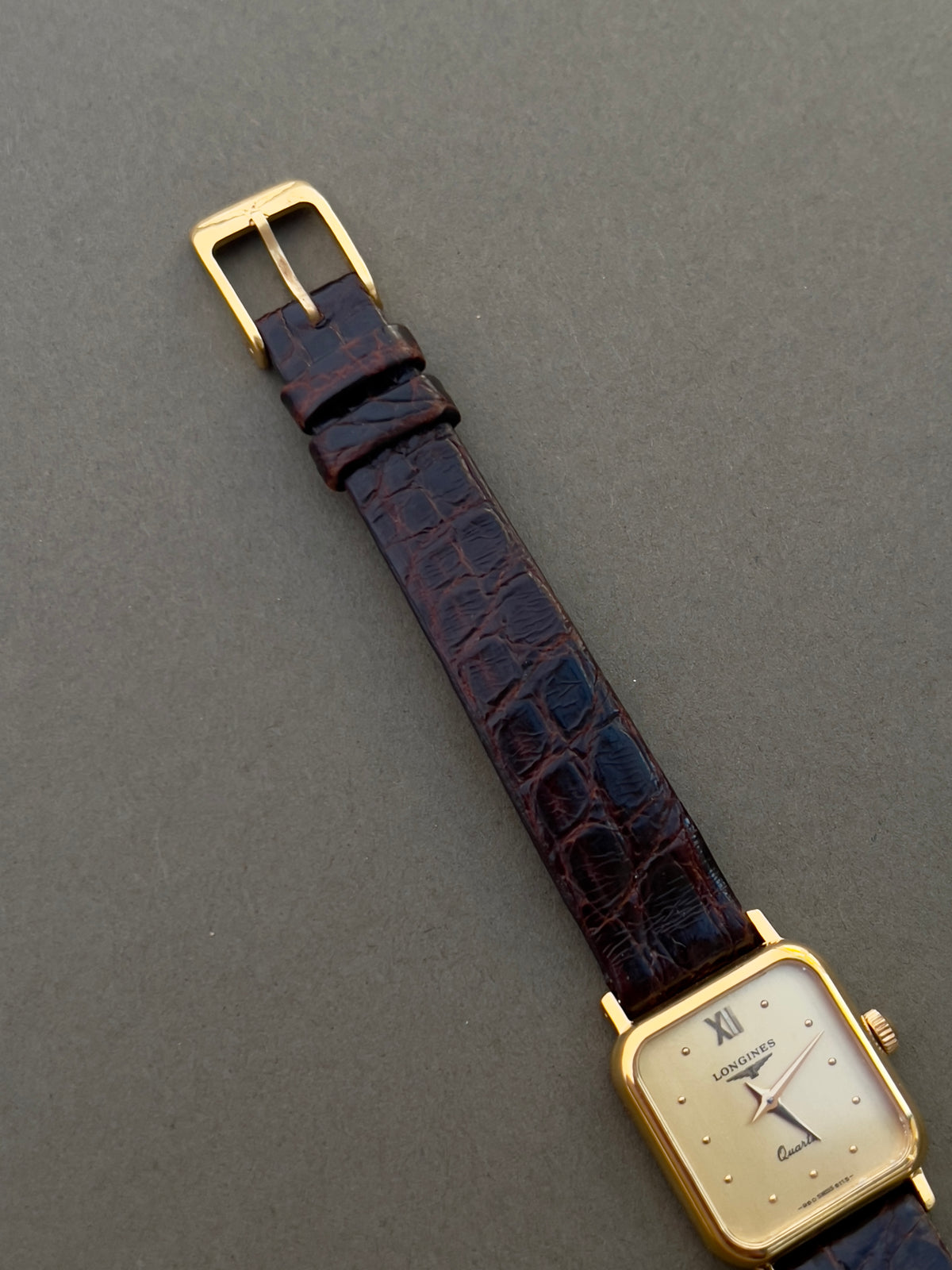 Longines Gold Toned Soft Rectangular Women's Watch, caseback detail of a vintage women's watch at Gilded Hour.