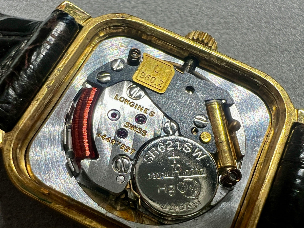 Longines Gold Toned Soft Rectangular Women's Watch, wrist shot of a vintage women's watch at Gilded Hour.