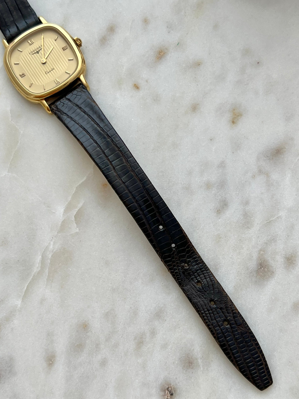 Longines Cushion Champagne Stripe Women’s Watch — Close view of the leather strap tip