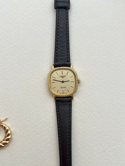Close-up caseback detail of the vintage Longines gold cushion watch.