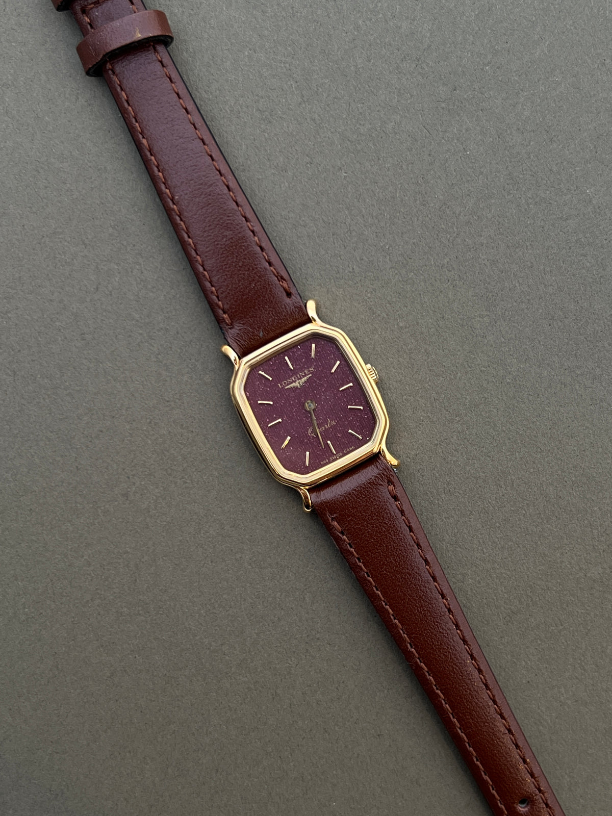 Longines Gold Wine Dial watch — angled case view