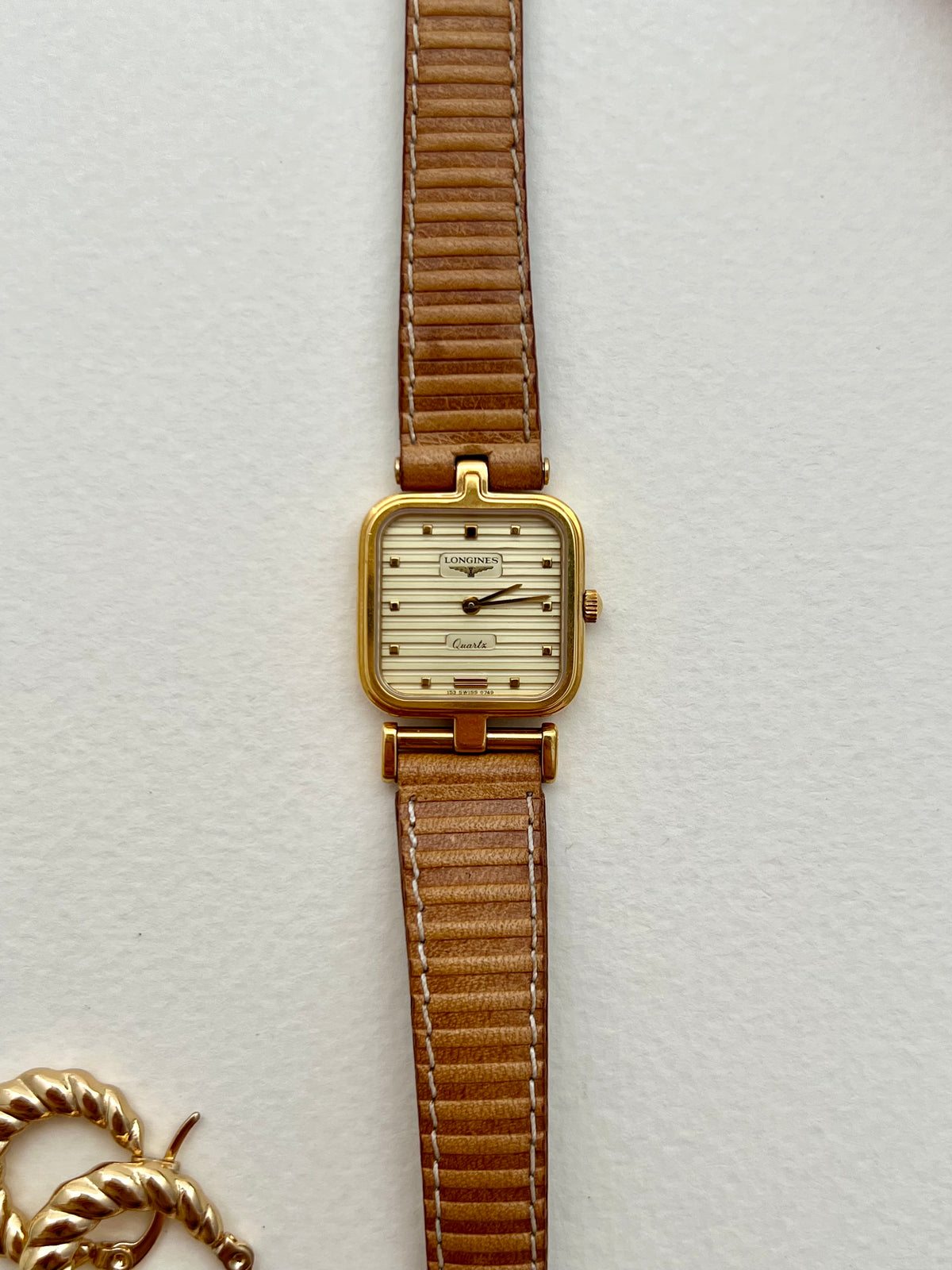 Angled view of the Longines square-cushion case and asymmetrical lugs.