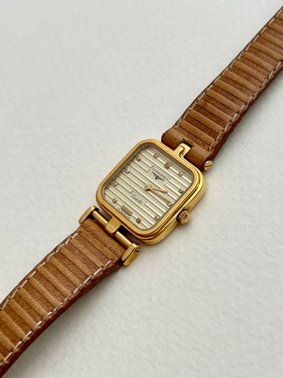 Caseback detail of the Longines square-cushion watch.