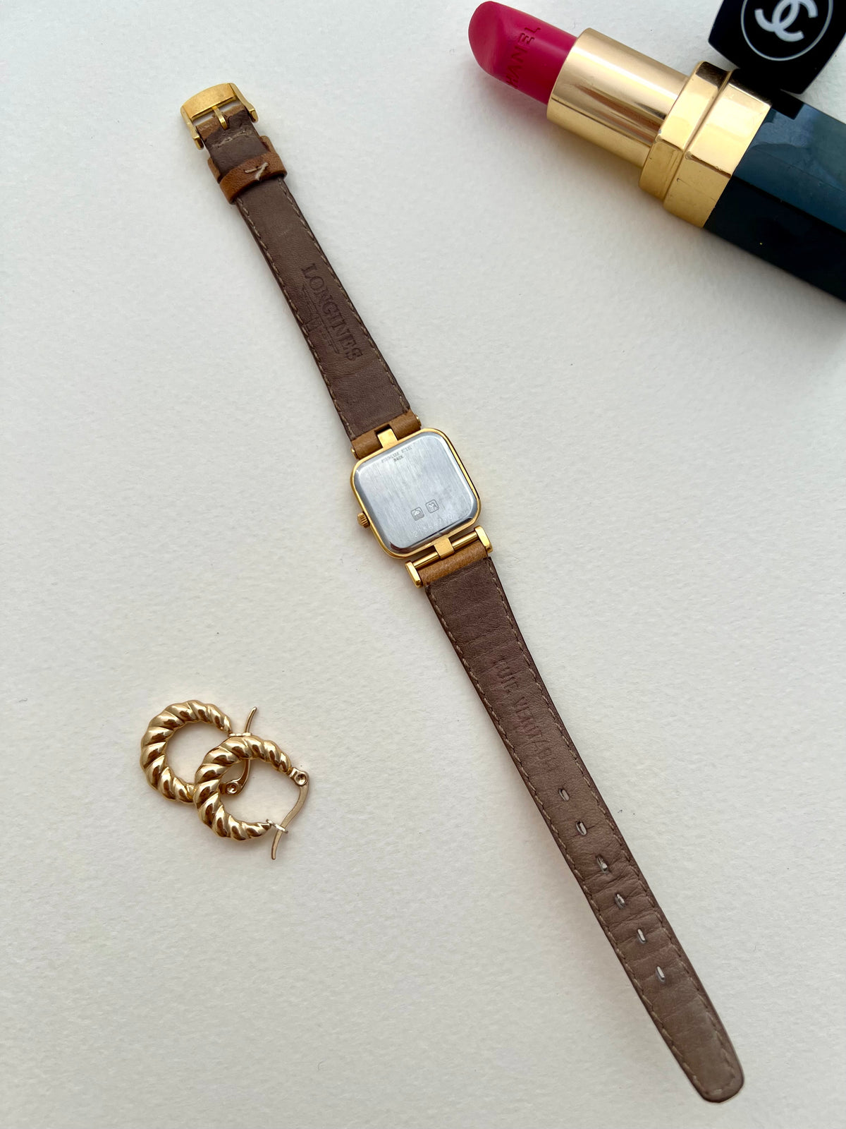 Additional front view of the Longines ridged champagne dial and gold case.