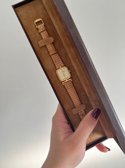 Longines watch shown with its original presentation box.