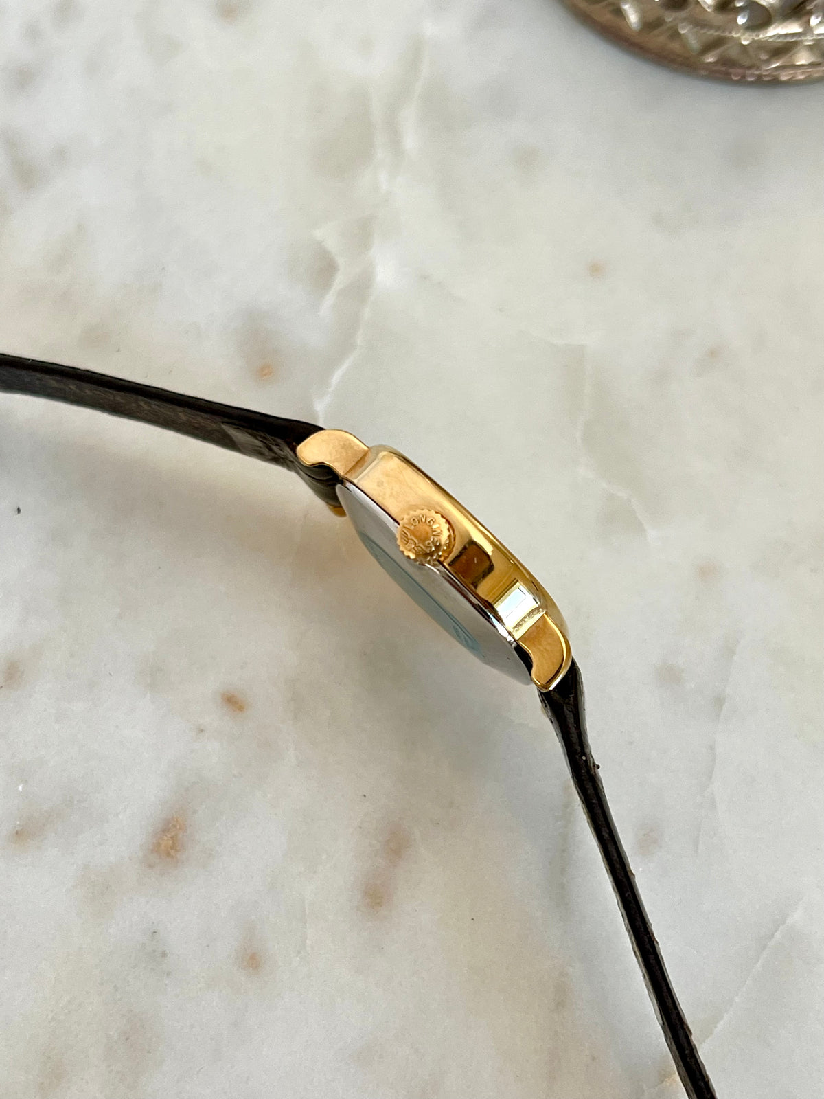 Longines Gold Round Champagne Dial watch — case side