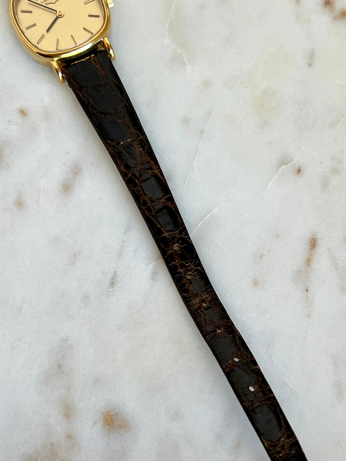 Longines Gold Round Champagne Dial watch — strap and dial