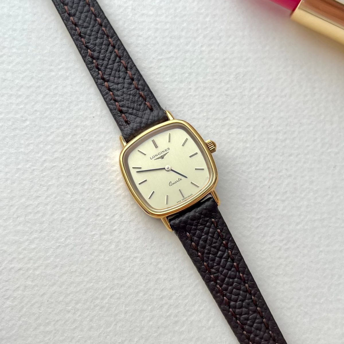 Longines Champagne Dial Gold Cushion Leather watch: close view of the dial and case.