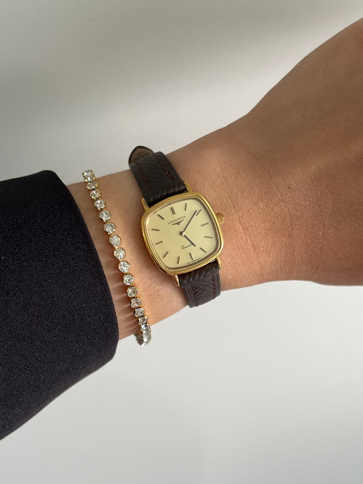 Longines Champagne Dial Gold Cushion Leather watch: watch worn on the wrist.
