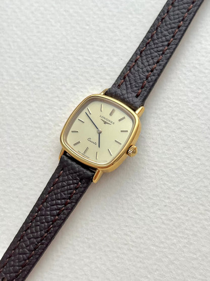 Longines Champagne Dial Gold Cushion Leather watch: angled view of the dial and case.