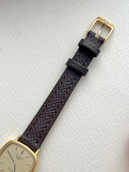 Longines Champagne Dial Gold Cushion Leather watch: strap and buckle detail.