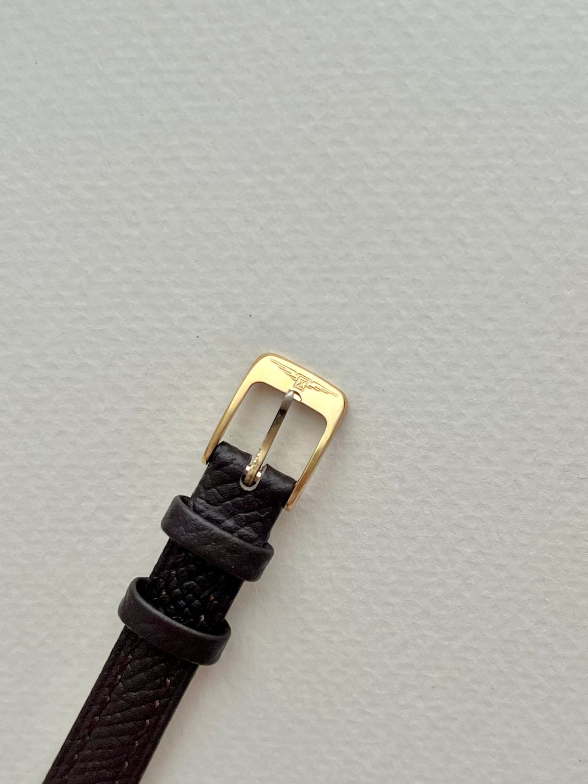 Longines Champagne Dial Gold Cushion Leather watch: strap and buckle detail.