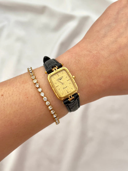 Longines Gold Toned Rectangular Womans Watch with Intricate Details, front view of a vintage women's watch at Gilded Hour.