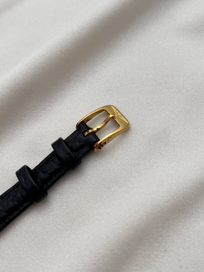Longines Gold Toned Rectangular Womans Watch with Intricate Details, case profile of a vintage women's watch at Gilded Hour.