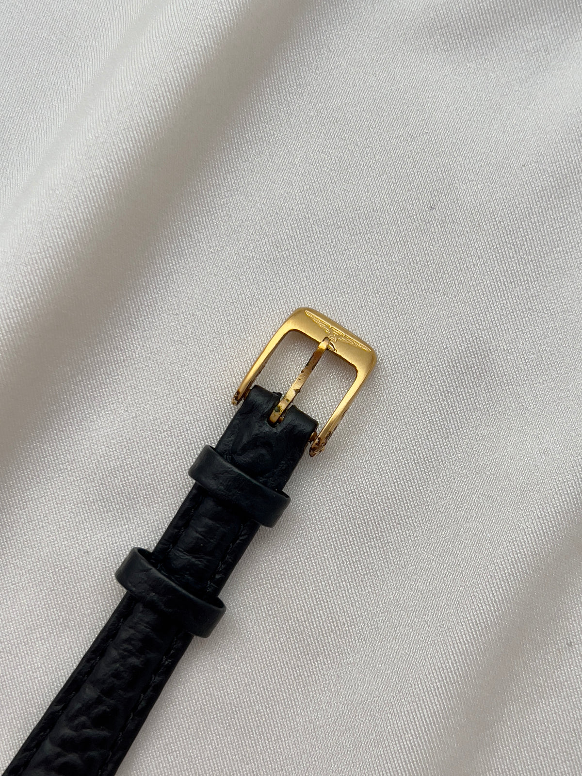 Longines Gold Toned Rectangular Womans Watch with Intricate Details, bracelet detail of a vintage women's watch at Gilded Hour.