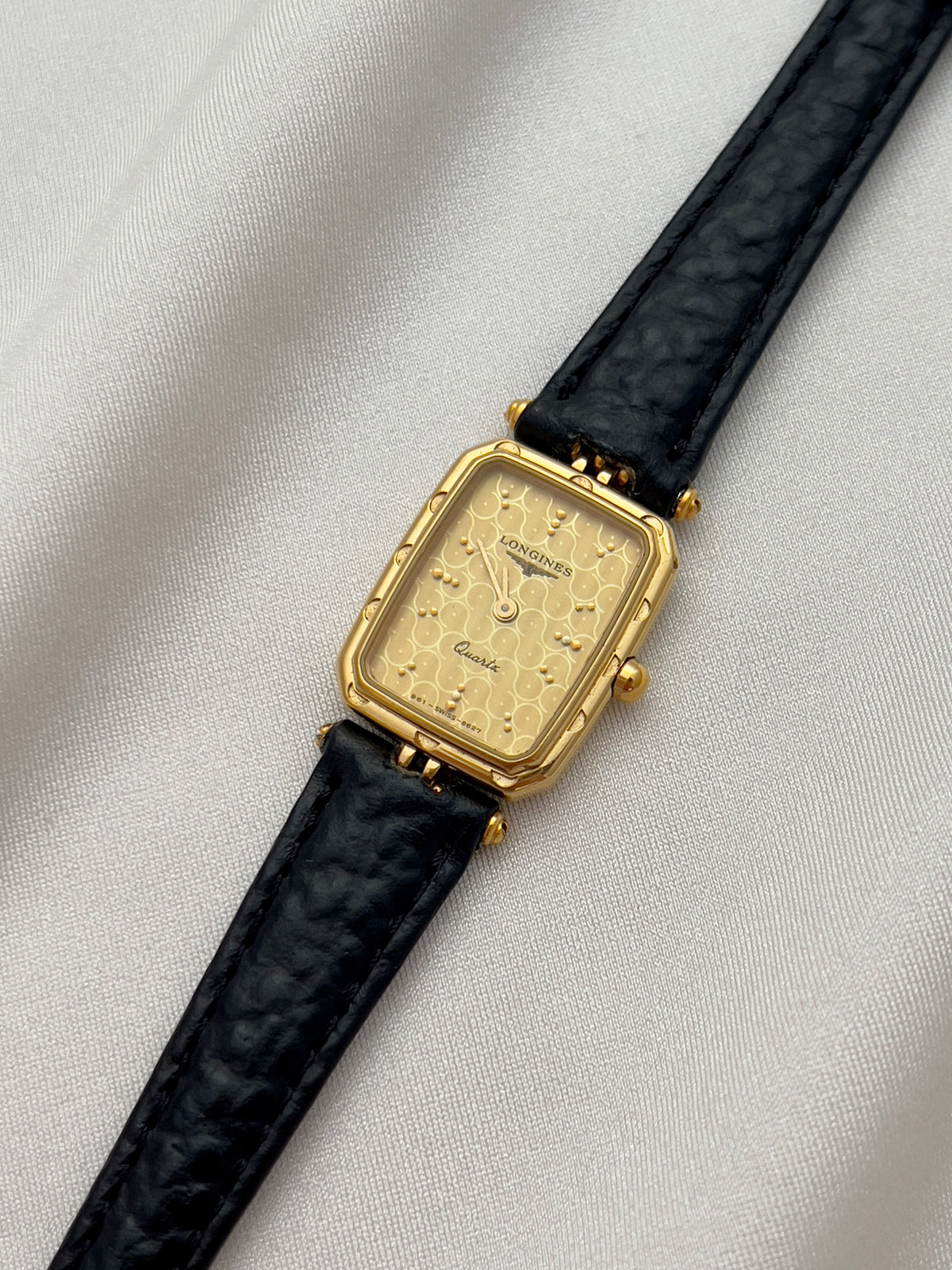 Longines Gold Toned Rectangular Womans Watch with Intricate Details, front view of a vintage women's watch at Gilded Hour.