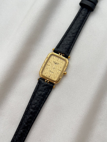 Longines Gold Toned Rectangular Womans Watch with Intricate Details, dial close up of a vintage women's watch at Gilded Hour.