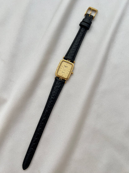 Longines Gold Toned Rectangular Womans Watch with Intricate Details, angled view of a vintage women's watch at Gilded Hour.