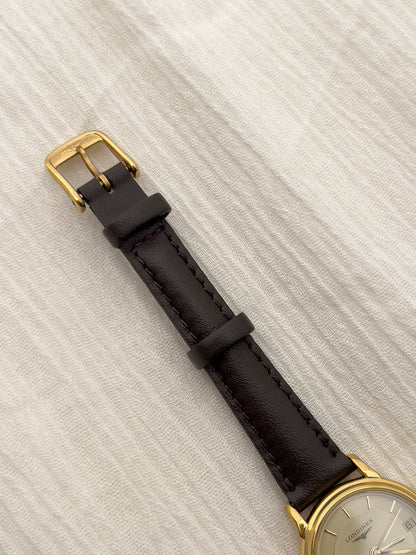 Detail of the aftermarket leather strap and original clasp on the Longines watch.