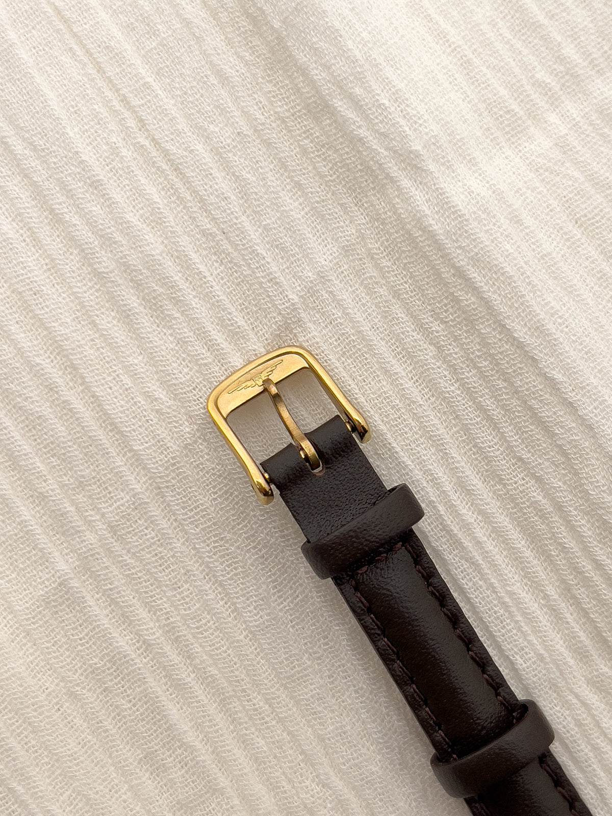Caseback detail of the Longines quartz watch.