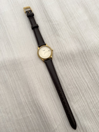 Close-up of the patterned champagne dial on the Longines La Grande Classique watch.