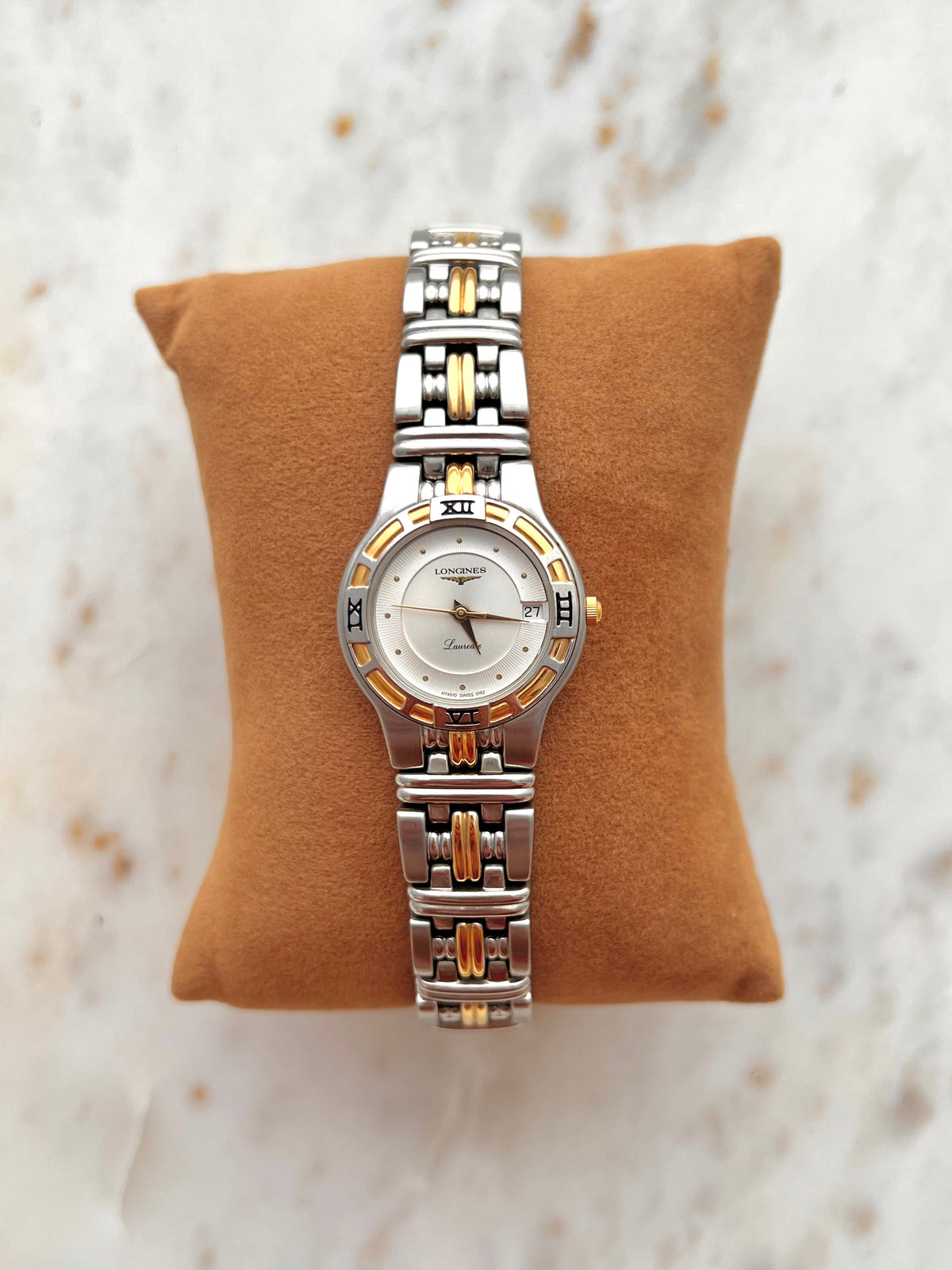 Longines Laureate Roman Bezel Two Tone watch: front view on a display cushion.