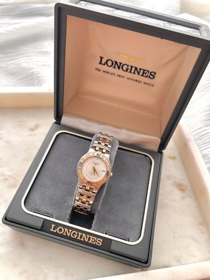 Longines Laureate Roman Bezel Two Tone watch: watch displayed in a Longines box.