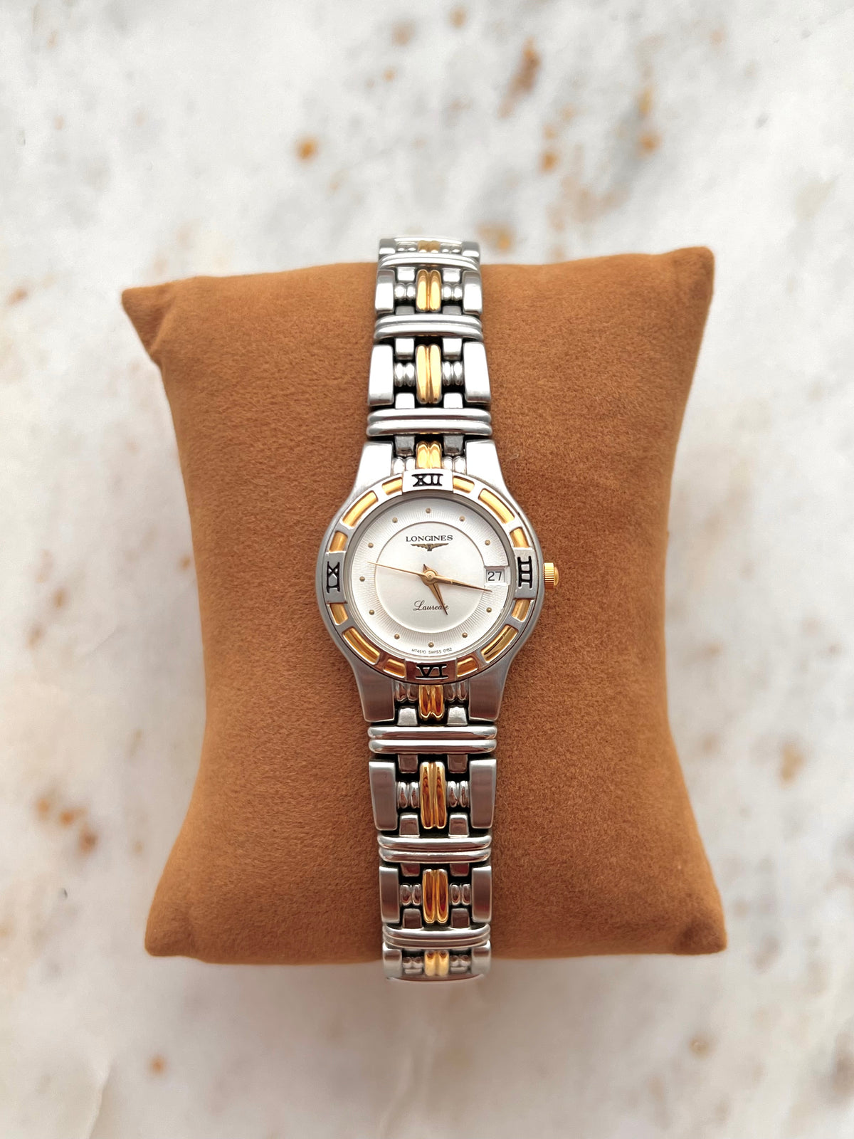 Longines Laureate Roman Bezel Two Tone watch: front view on a display cushion.