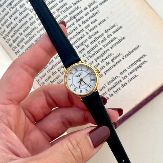 Longines Les Grandes Classiques ladies watch with gold-tone case, white Roman numeral dial and date, product photo 1.