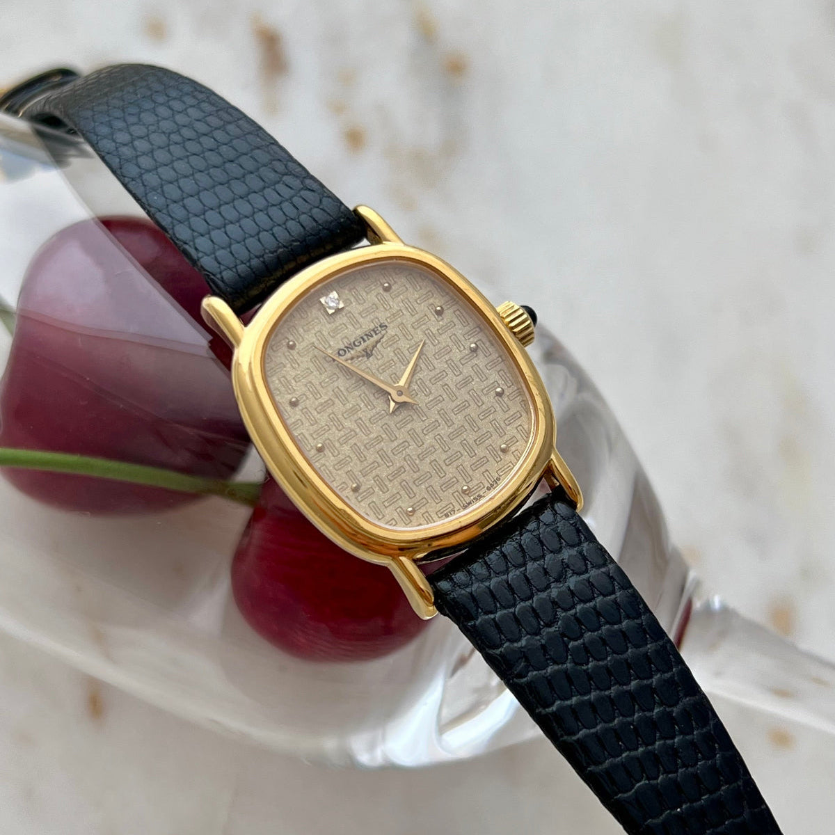 Longines Oblong Patterned Dial Women’s Watch — Close view of the patterned dial across a glass