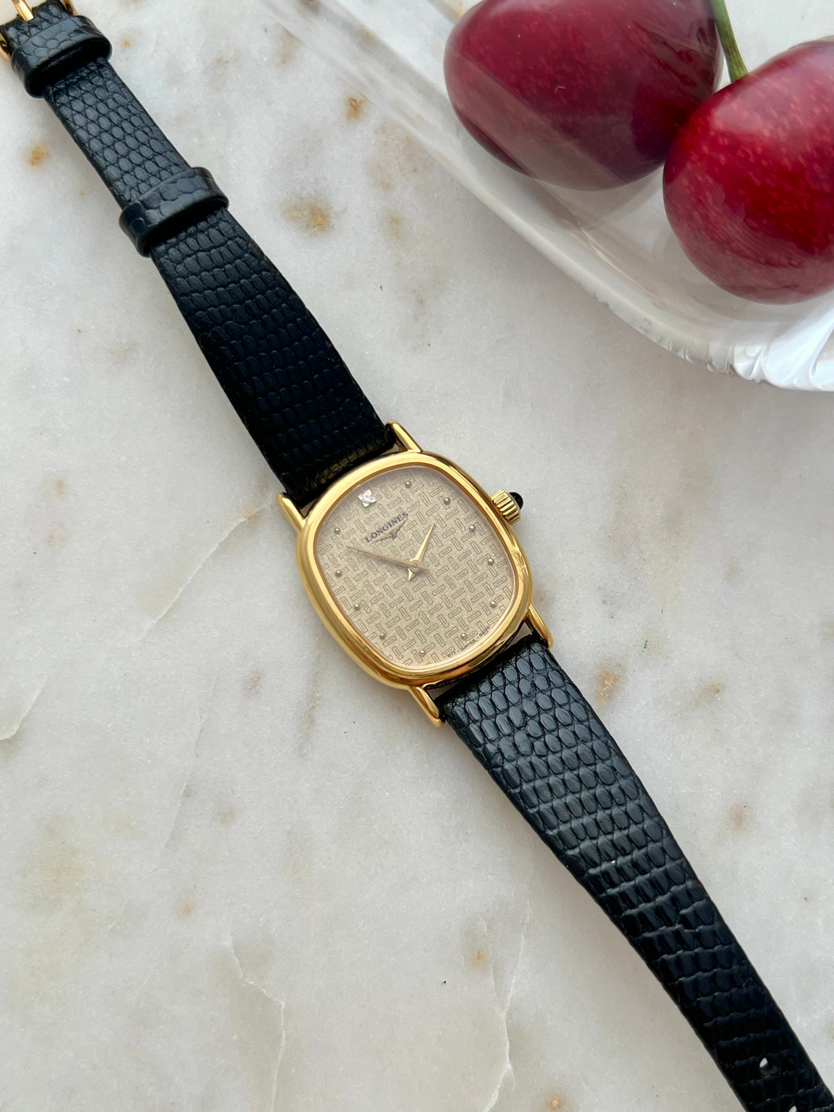 Longines Oblong Patterned Dial Women’s Watch — Angled front view of the case and black strap