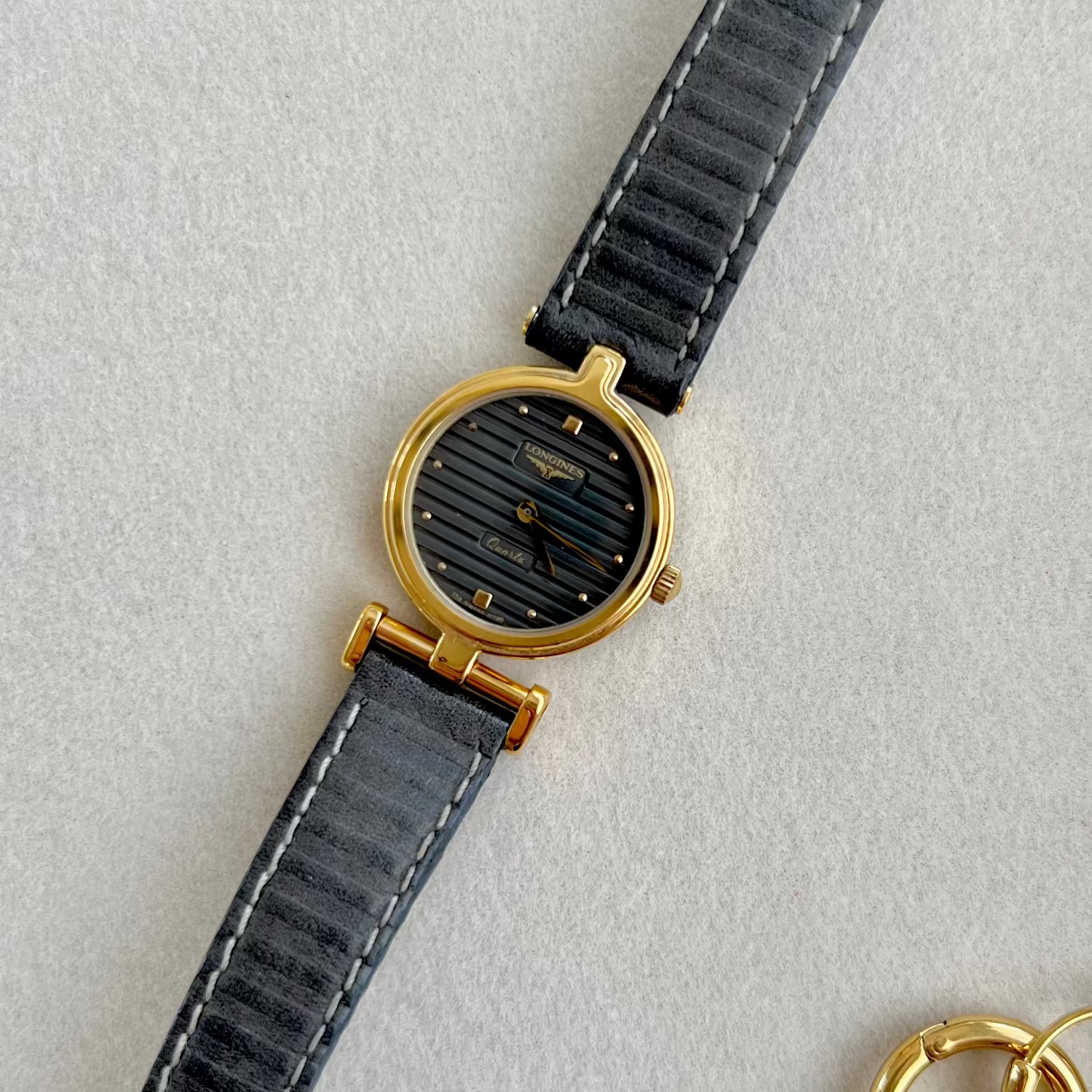 Longines Ribbed Dial Women’s Watch — dark ribbed dial and asymmetric lugs
