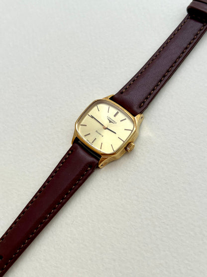 Close-up of the brown aftermarket strap and buckle on the Longines soft octagonal watch.