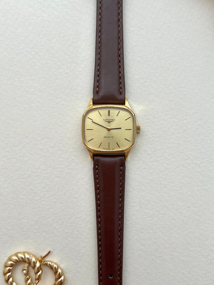 Longines soft octagonal ladies watch photographed with a display box.