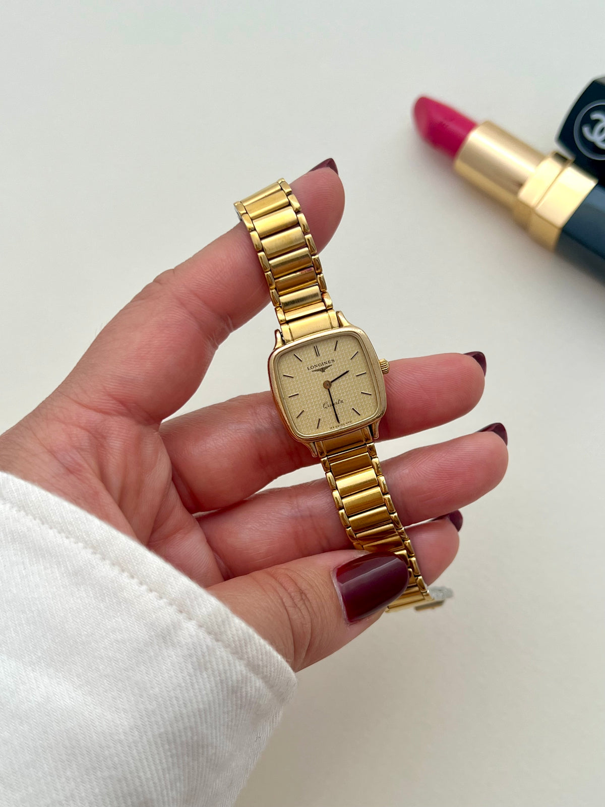 Longines gold bracelet watch presented with its box.