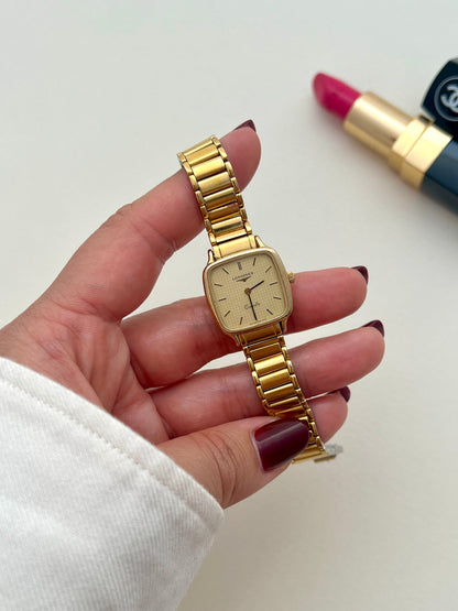 Longines gold bracelet watch presented with its box.