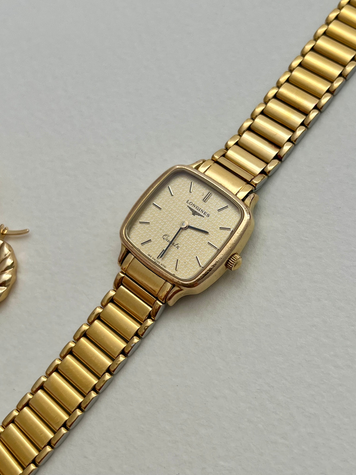 Caseback detail of the vintage Longines soft-square gold-tone ladies watch.