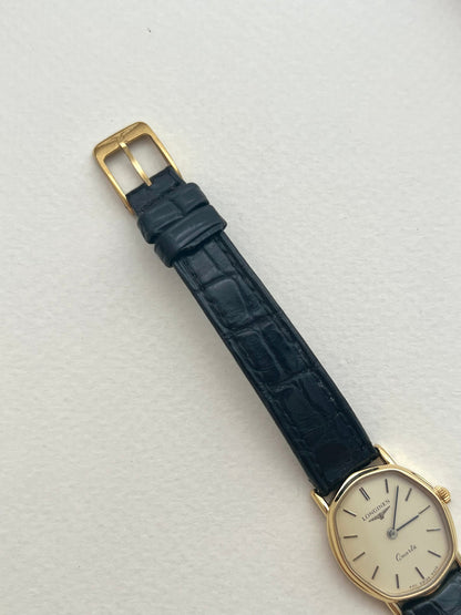 Front view of the Longines soft tonneau ladies watch with cream dial and black leather strap.
